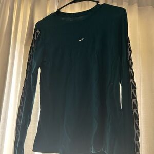 Green Nike long sleeve with Nike logos down the side